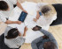 Close up on young colleagues having a meeting, view from top down