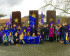 Volters standing with flags at the European Memorial at Schengen (Luxembourg).