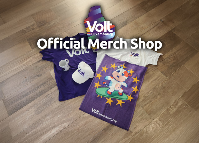Volt merchandise lying on the floor, a t-shirt, a polo, a cup, a cap and a towel. Over it it says 