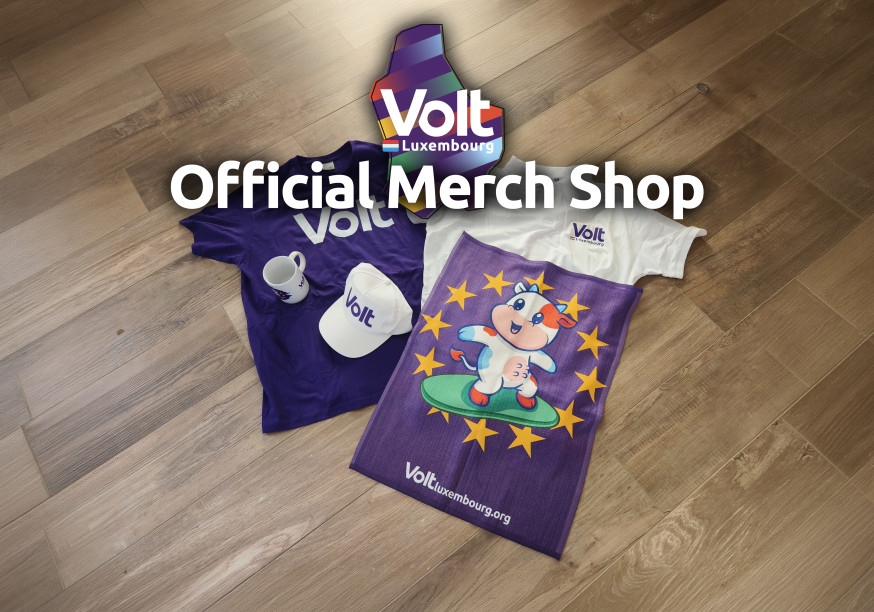 Volt merchandise lying on the floor, a t-shirt, a polo, a cup, a cap and a towel. Over it it says 