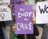 Women holding posters which read 